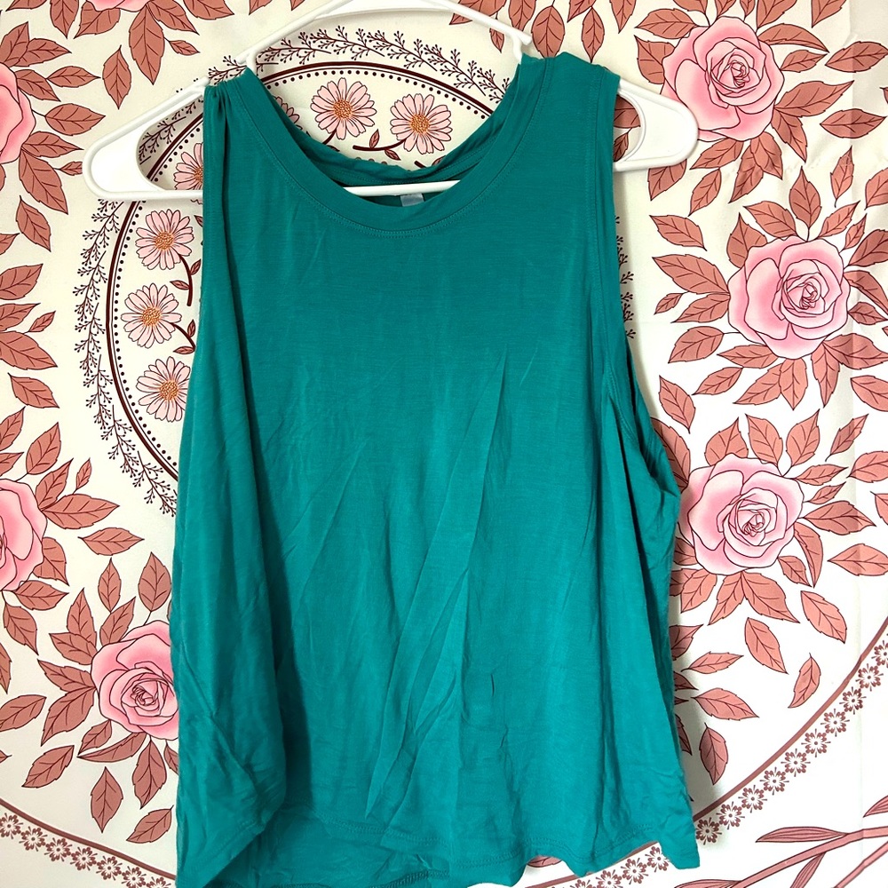 Blue Xl sized racerback, cropped shirt. Light weight and breathable.